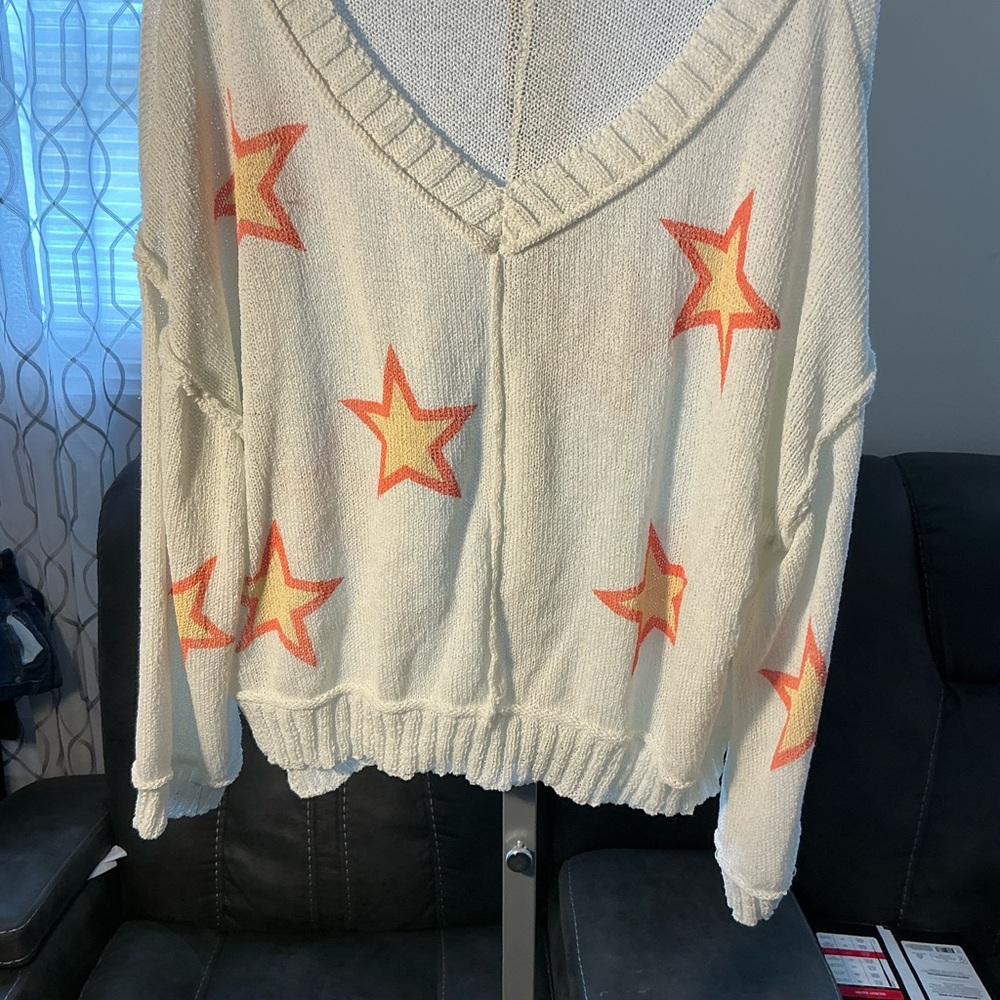 POL Cream V-Neck Star Print Sweater with Orange and Yellow Stars